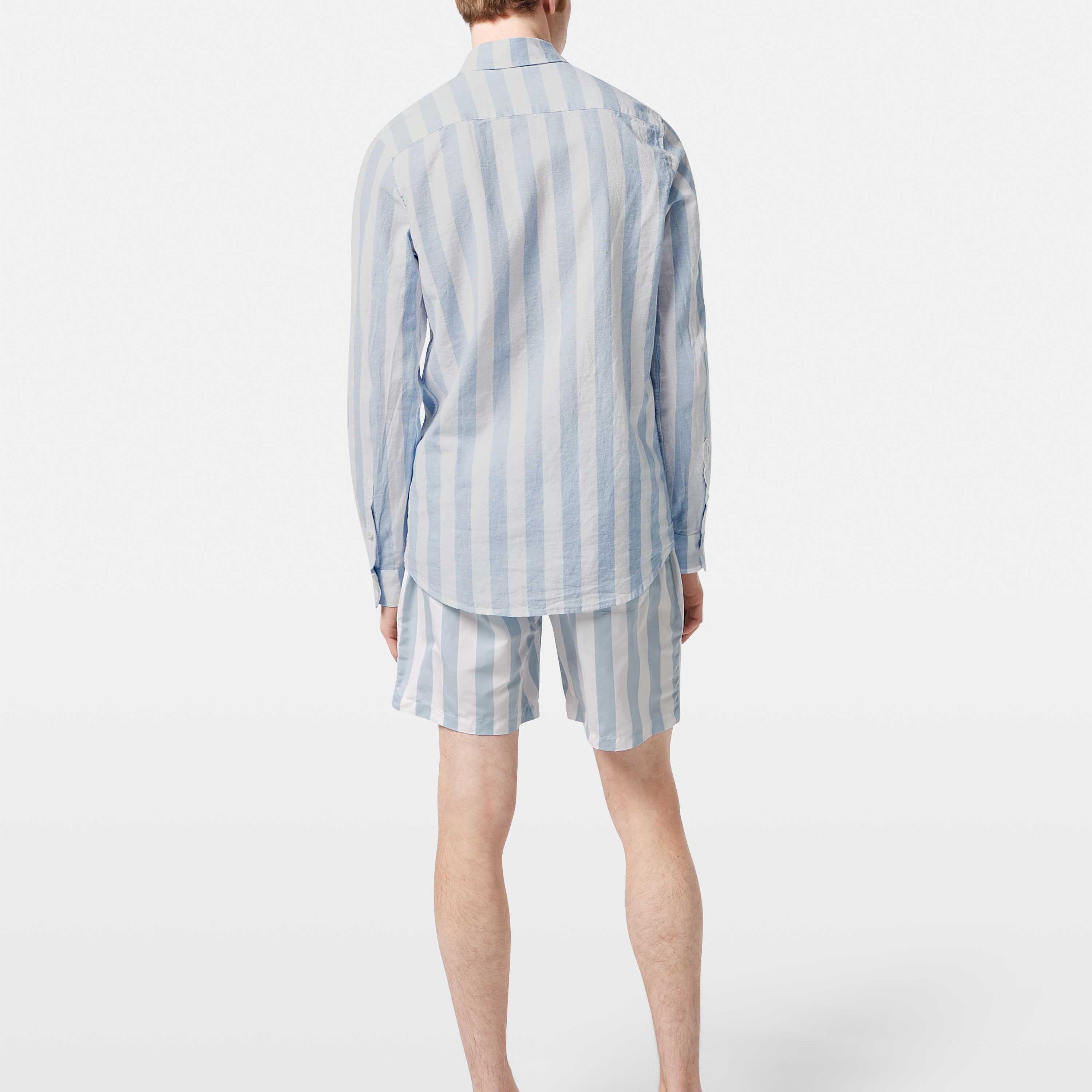 This lightweight long-sleeved seersucker shirt features classic stripes and a textured finish, blending comfort with effortless style.
100% Cotton
Regular fit