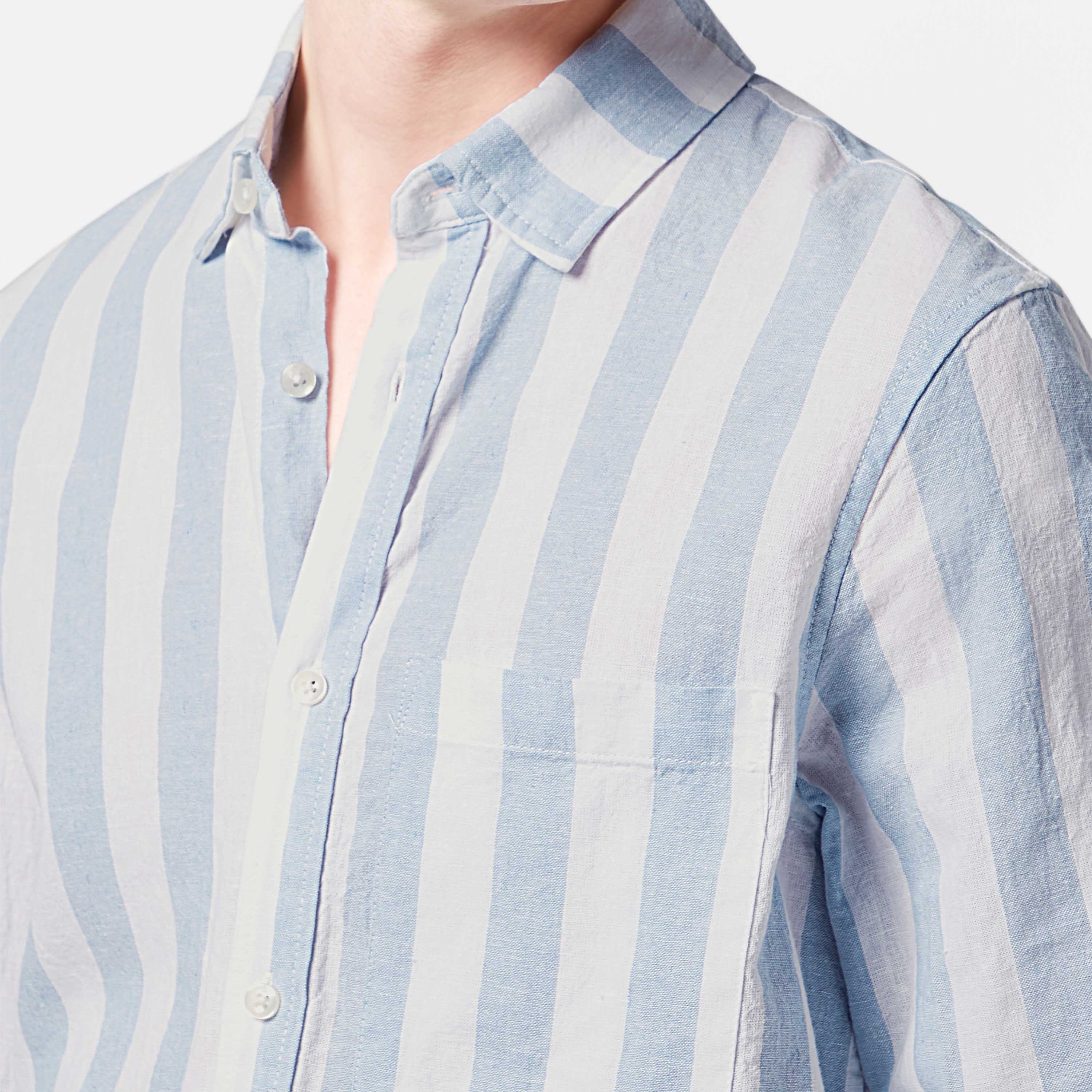 This lightweight long-sleeved seersucker shirt features classic stripes and a textured finish, blending comfort with effortless style.
100% Cotton
Regular fit