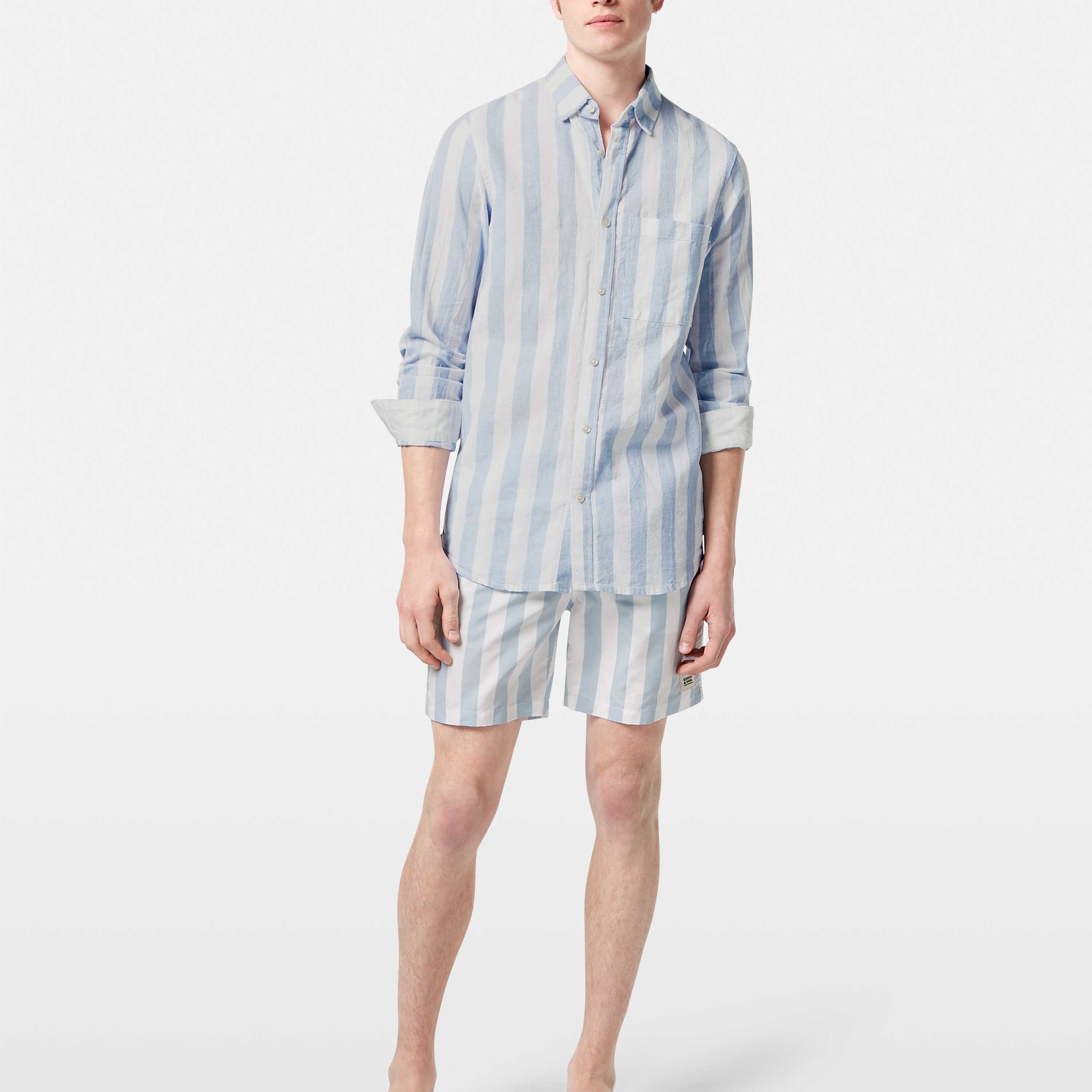 This lightweight long-sleeved seersucker shirt features classic stripes and a textured finish, blending comfort with effortless style.
100% Cotton
Regular fit
