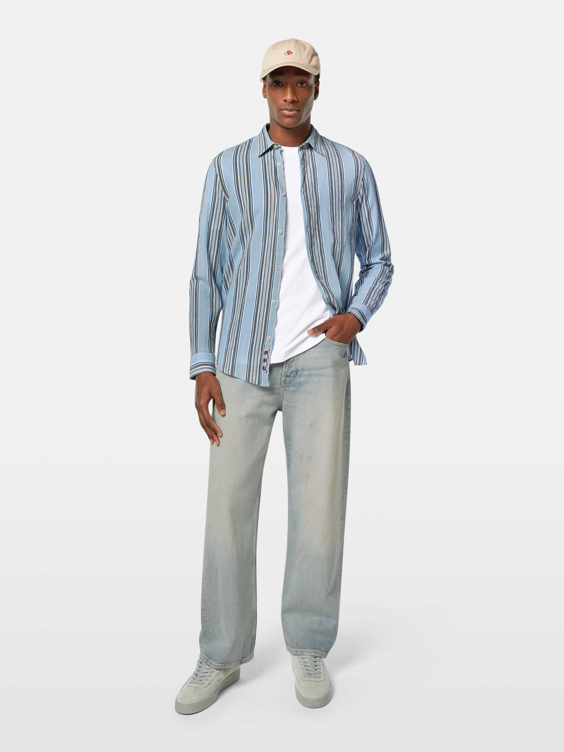 Designed for effortless style, this crinkle-stripe shirt offers a textured finish with a relaxed fit.

100% Cotton