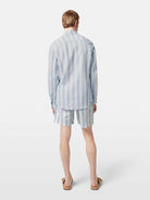 This lightweight long-sleeved seersucker shirt features classic stripes and a textured finish, blending comfort with effortless style.

100% Cotton

Regular fit