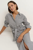 Say yes to timeless stripes with a modern twist, the Forward Black Stripe Shirt Dress blends structure and ease in all the right ways. With its flattering tie waist, crisp collar, and functional pockets, this dress does it all without ever feeling fussy. Throw it on and go, or style it up with your favourite accessories. A true high-low hero, equally perfect for desk days, market strolls or casual catch-ups.

- Classic black and white vertical stripe
- Button-down front with shirt collar
- Removable waist t