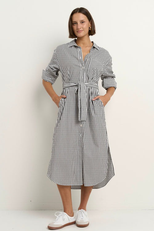 Say yes to timeless stripes with a modern twist, the Forward Black Stripe Shirt Dress blends structure and ease in all the right ways. With its flattering tie waist, crisp collar, and functional pockets, this dress does it all without ever feeling fussy. Throw it on and go, or style it up with your favourite accessories. A true high-low hero, equally perfect for desk days, market strolls or casual catch-ups.

- Classic black and white vertical stripe
- Button-down front with shirt collar
- Removable waist t