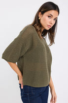 Easygoing yet elevated, the Sunrise cotton knit tee is your new off-duty go-to. With a breezy open weave and relaxed fit, it brings effortless texture and breathability to your everyday style. Perfect for layering or wearing solo.

This tee strikes the perfect balance between casual and cool, making it ideal for high-low dressing with tailored trousers or relaxed denim.

- 100% natural cotton for breathable comfort
- Textured open knit
- Relaxed boxy silhouette with short sleeves
- Lightweight and perfect f